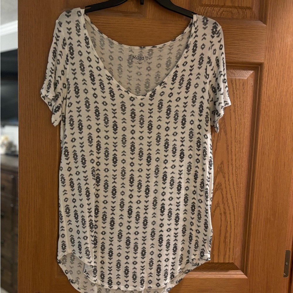 Short sleeved white top with black print. Size large.